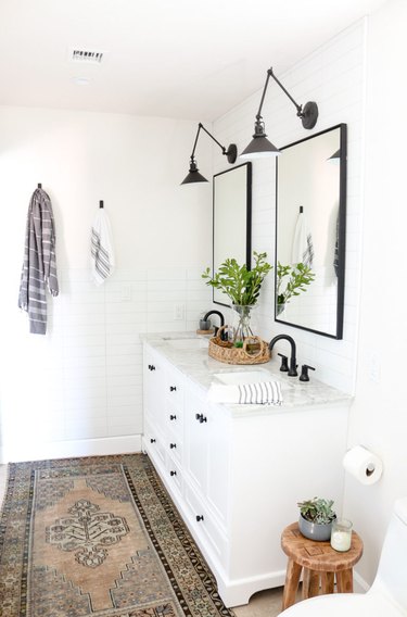 double sink bathroom lighting idea with articulating sconces