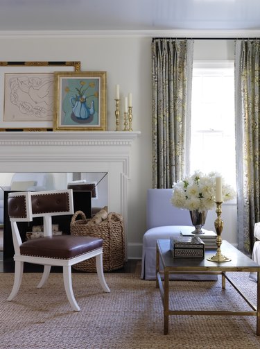 white painted fireplace with mirrored surround