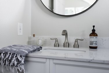 close up of bathroom countertop and sink