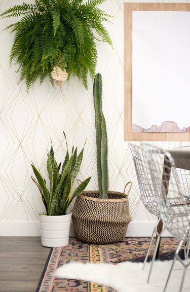 gold and white art deco DIY project with geometric accent wall in dining room