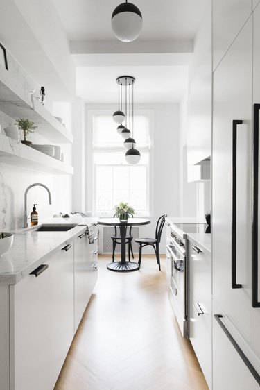 white kitchen with black cabinet hardware