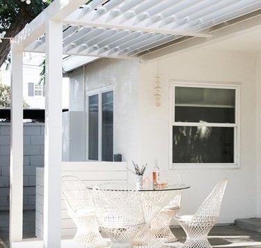 White modern pergola, white dining set