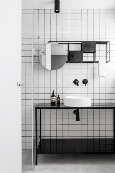 white tile backsplash in bathroom with minimalist bathroom storage