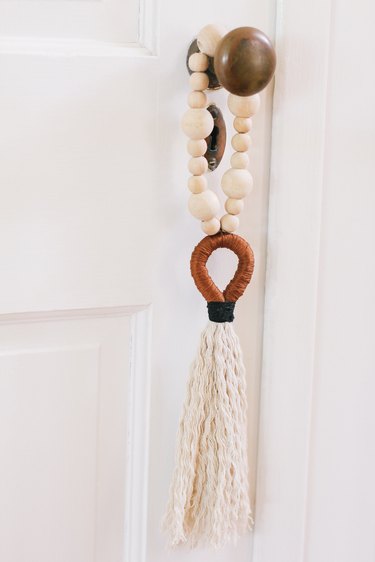 Tassel and beads hung on door
