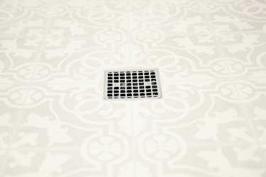 square shower drain, ivory tile with white decorative design