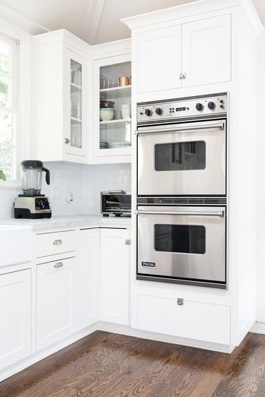 double wall oven installed in white cabinetry