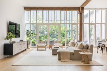 simple family room furniture with wall-mounted TV and gray sectional