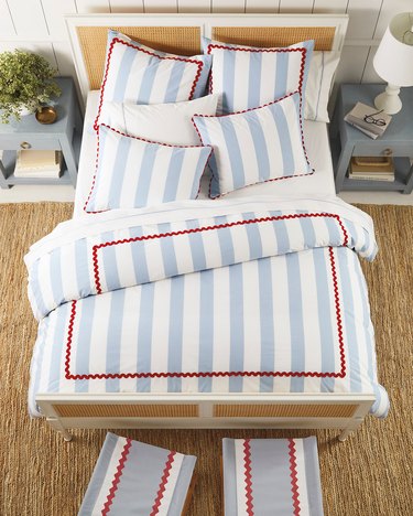 bed with blue-and-white striped bedding