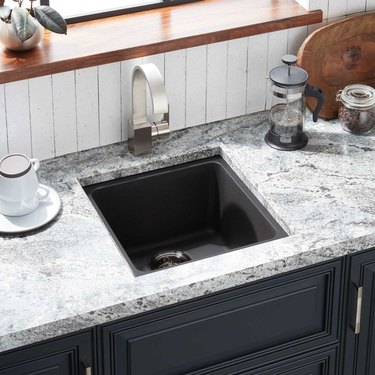 Composite granite minimalist kitchen sink with modern stainless steel faucet