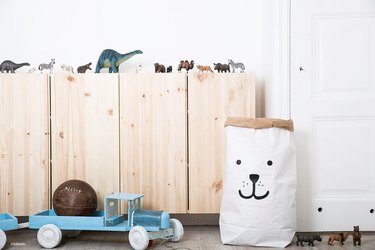 Minimalist toy storage idea in white paper bag with bear face