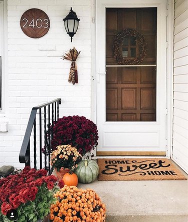 modern house numbers on wood plaque