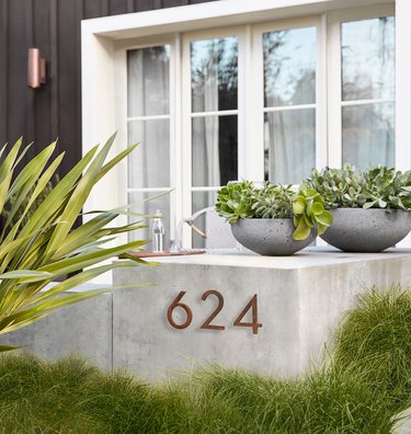steel modern house numbers on concrete slab by Rejuvenation