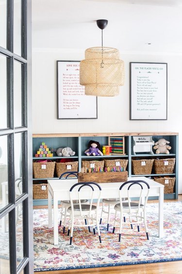 eclectic Playroom Organization Ideas with storage units, baskets and table