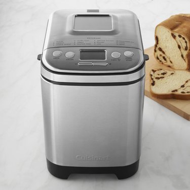 bread maker with bread nearby