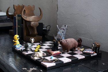 Black and white chessboard with various creatures