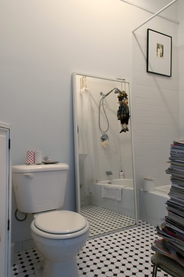 White bathroom with black and white tile floor