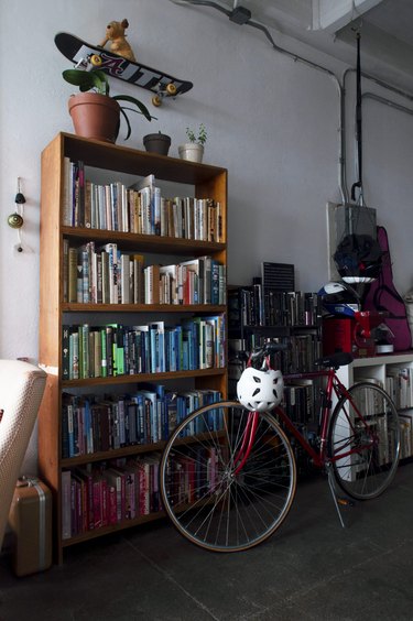 Bookshelves and bike in loft