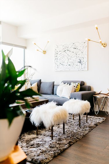 Living room lighting idea with gold sconces