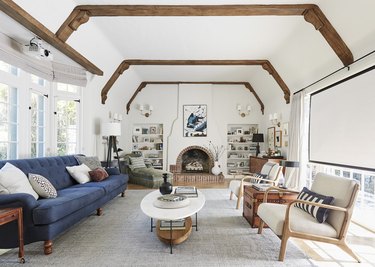 small living room idea with fireplace and exposed ceiling beams