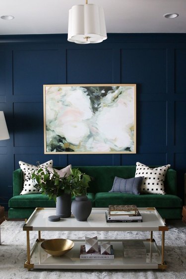 blue living room with green sofa