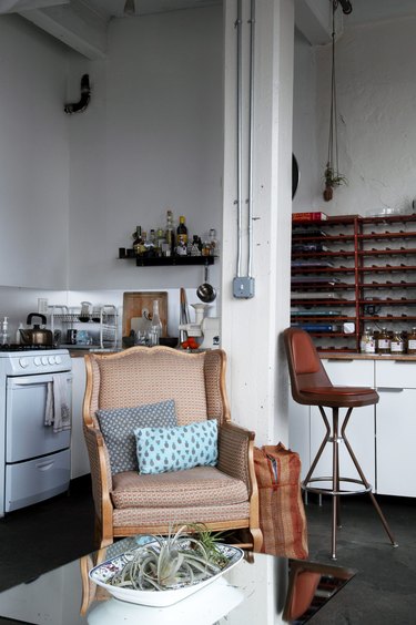 Loft in kitchen with white cabinetry