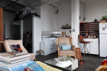 Loft in kitchen with white cabinetry