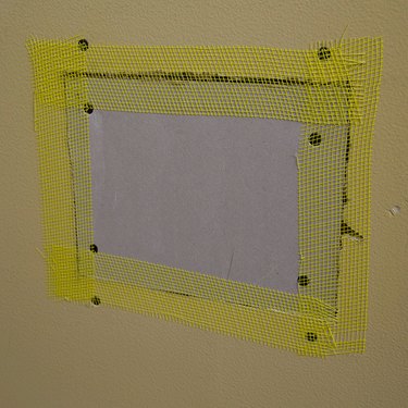 Drywall patch, taped.