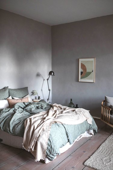 Lavender minimalist room paint colors in bedroom with green linen bedding