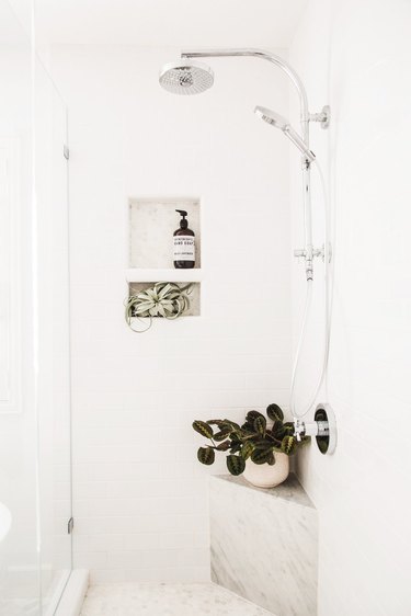 white shower storage ideas with marble corner ledge