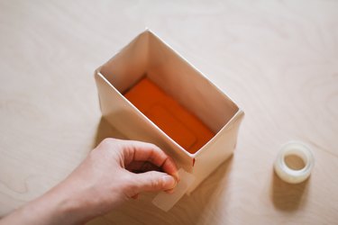 Taping sides of box