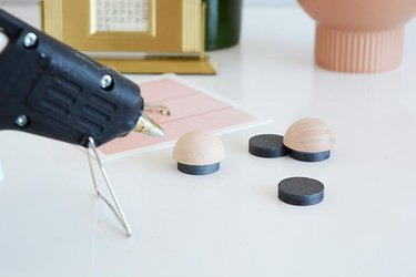 Glue magnets to wooden discs