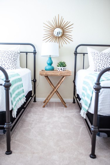 guest bedroom decorating idea with two metal frame beds