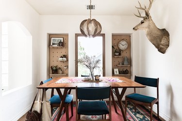 Dining room with deer head on wall