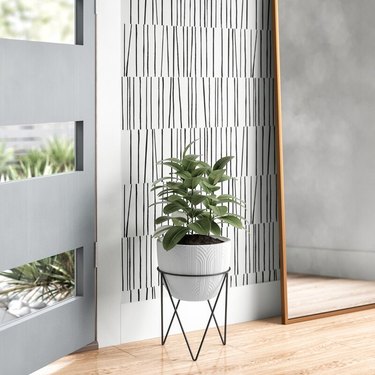 textured concrete planter on modern metal stand