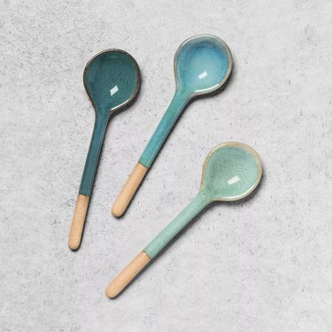 three stoneware appetizer spoon in hues of blue and green
