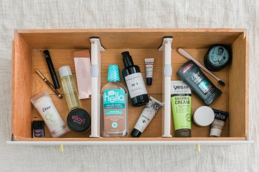 Divide daily toiletries into "His," "Hers," and "Theirs" collections using dividers.