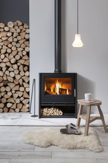 Scandinavian fireplace idea with freestanding wood burning stove