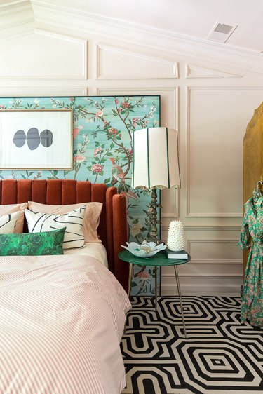 cream bedroom with patterned aqua panel