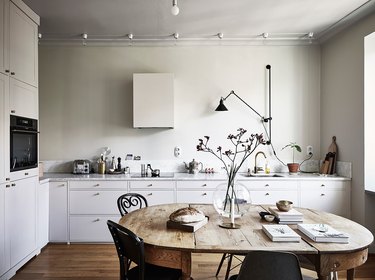 Scandinavian farmhouse style kitchen with vintage table and chairs