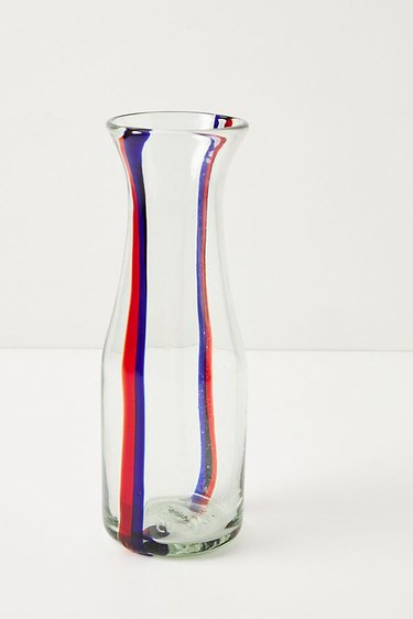 glass carafe with blue and red stripes