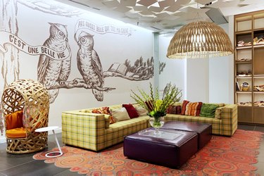 basement family room ideas with wall art and colorful rug