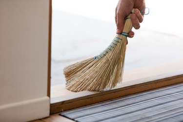 Hand broom sweeping floor