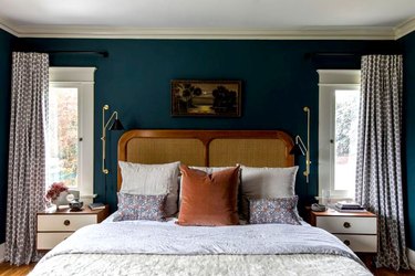 rattan and wood bed, teal walls