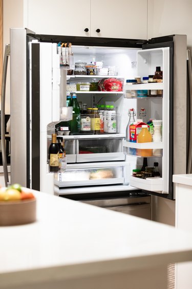 view of organized fridge with open doors