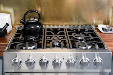 close up of grill grates of cooktop