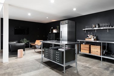 black kitchen with recessed lighting