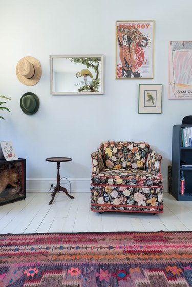 eclectic seating area with grandma style chair and mosaic picture wall