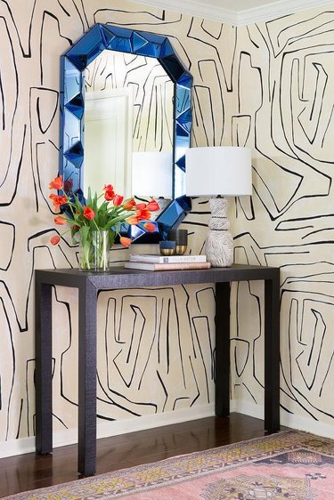 modern wallpaper with line pattern and blue entryway mirror