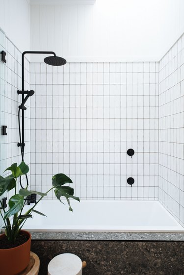 minimalist apartment ideas with grid bathroom shower tile and black shower head