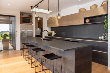 Modern kitchen with slate countertops and a slate backsplash